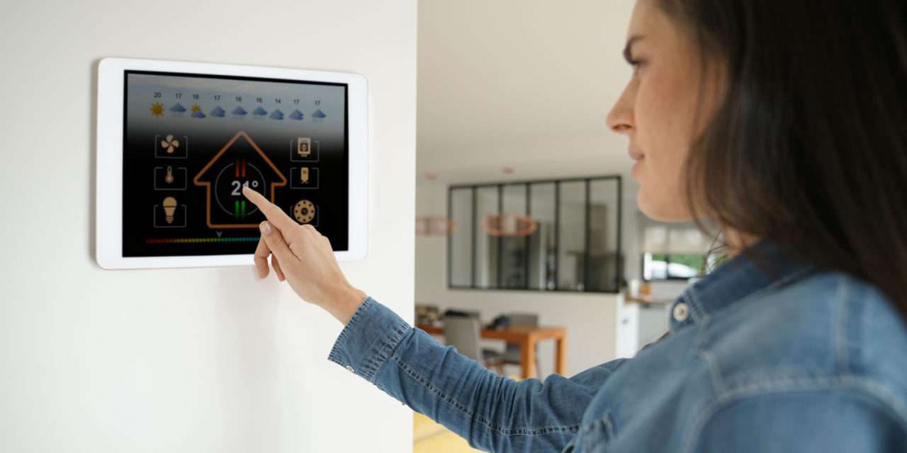 https://www.rpsmetalroofing.com/wp-content/uploads/2021/07/woman-adjusting-touchscreen-thermostat-1280x640.jpg