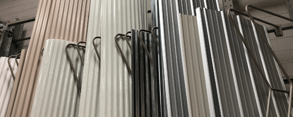 https://www.rpsmetalroofing.com/wp-content/uploads/2022/05/metal-roofing-panels-stored-upright.png