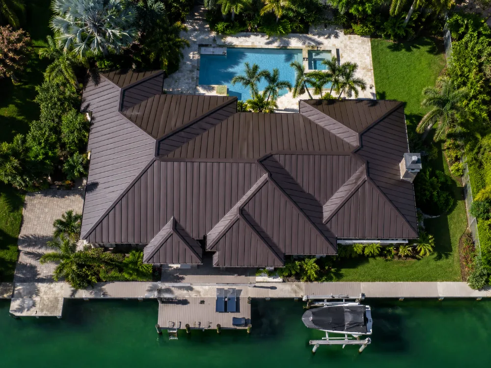 Dark bronze metal roof on a Florida home along the Intracoastal waterway