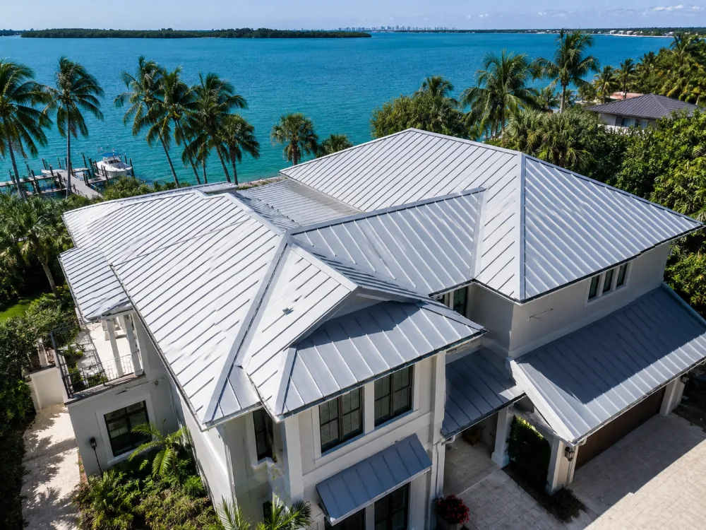 Silver metallic standing seam metal roof on a home along the Florida coast