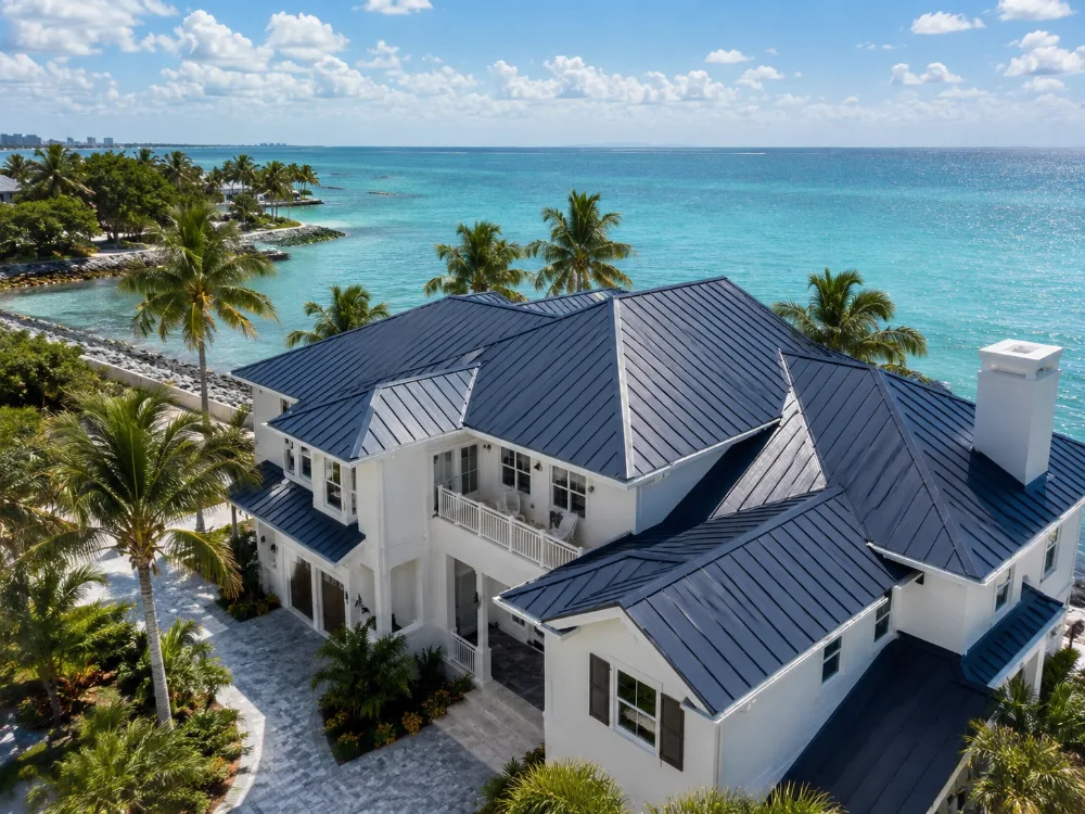 Standing seam metal roof on a Florida beach house overlooking turquoise water